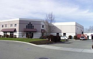 Green lawn at a light industrial facility after a suffessful sprinkler repair in Superior CO